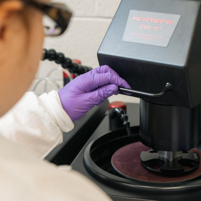 student using microscope 