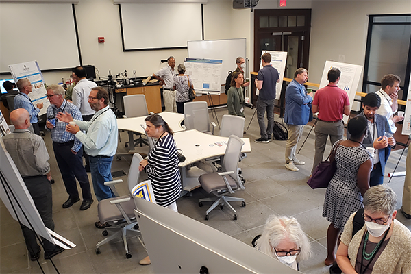 Guests attending the poster session