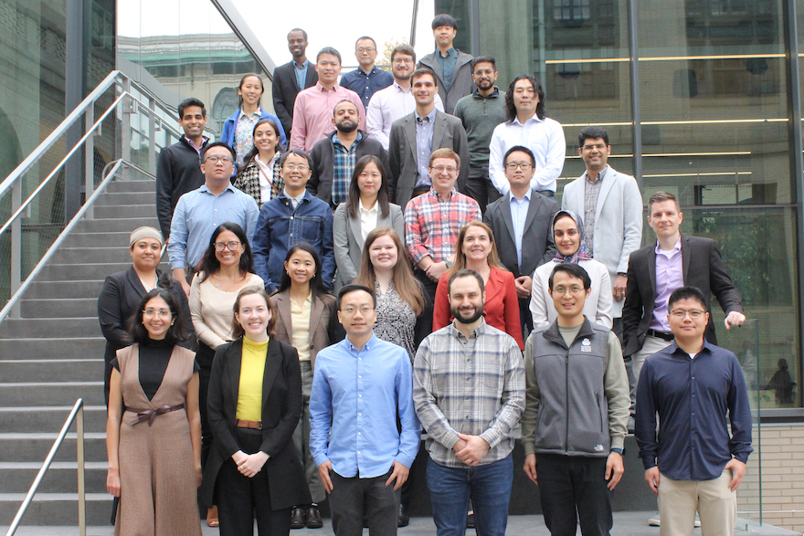 Group photo of participants on stairs outside