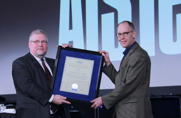 Chris Pistorius is handed his award from Barry Schneider