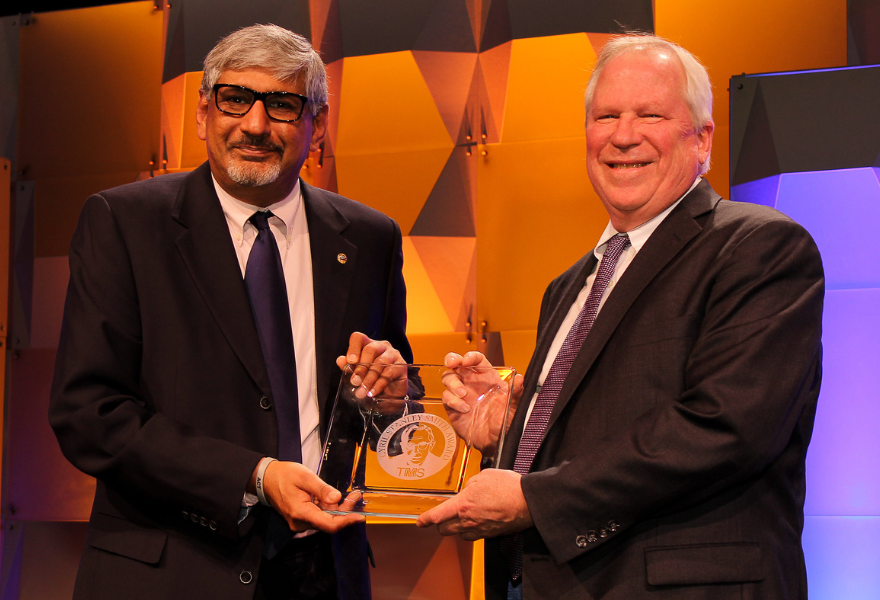 Greg Rohrer receiving award