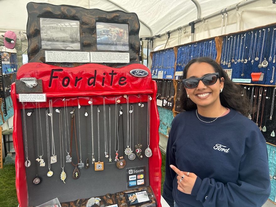 Woman standing in front of jewelry display