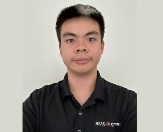 Adrian Tran wearing black SMS group shirt