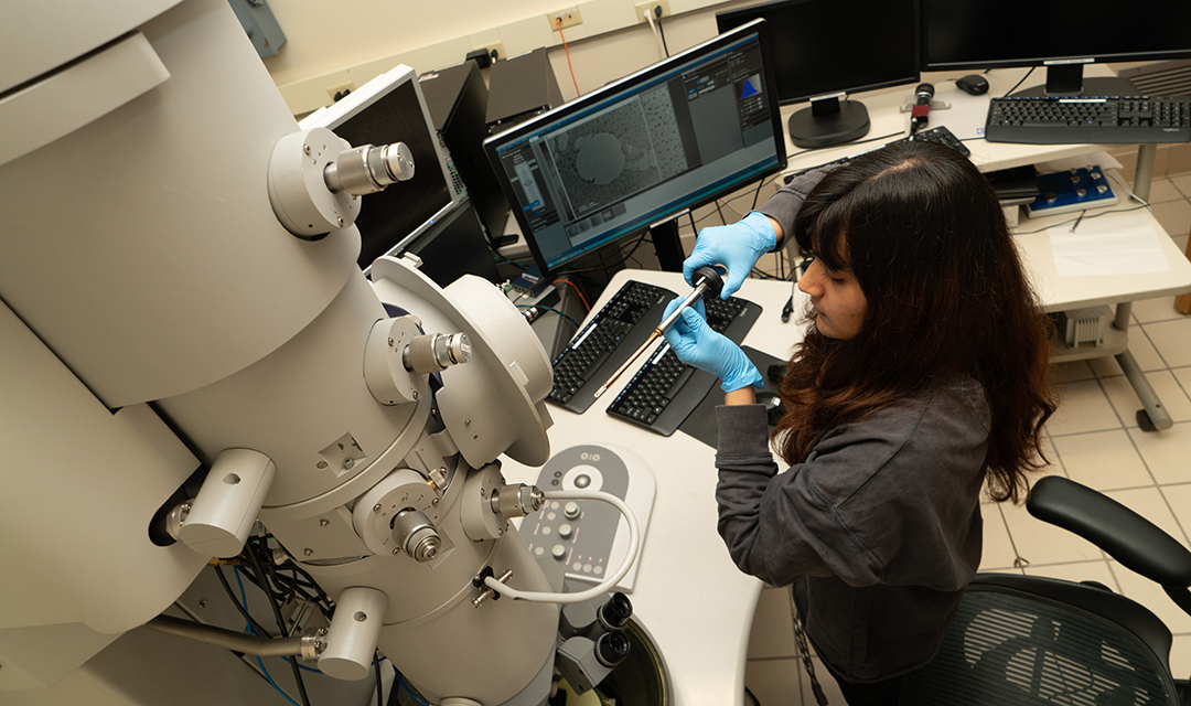 woman using a microscope